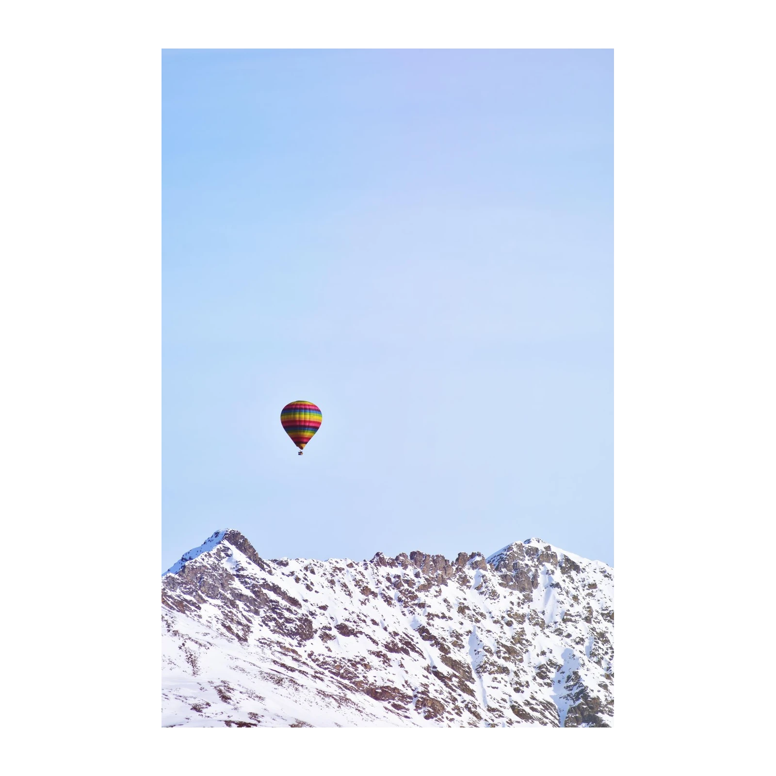 Vibrant Hot Air Balloon Over Snowy Peaks Wall Art